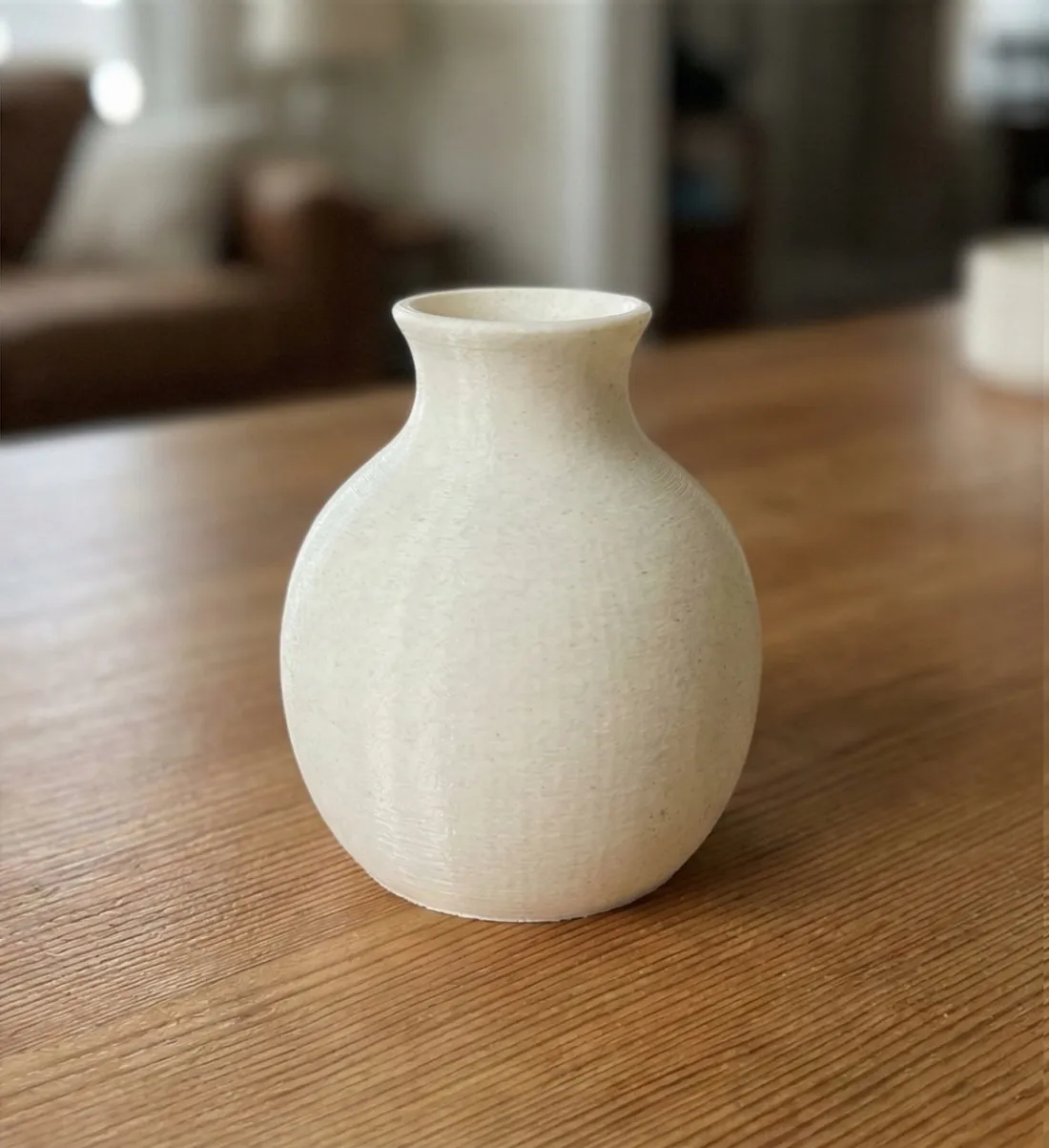 The same vase 3D printed in white filament from the AI-generated model